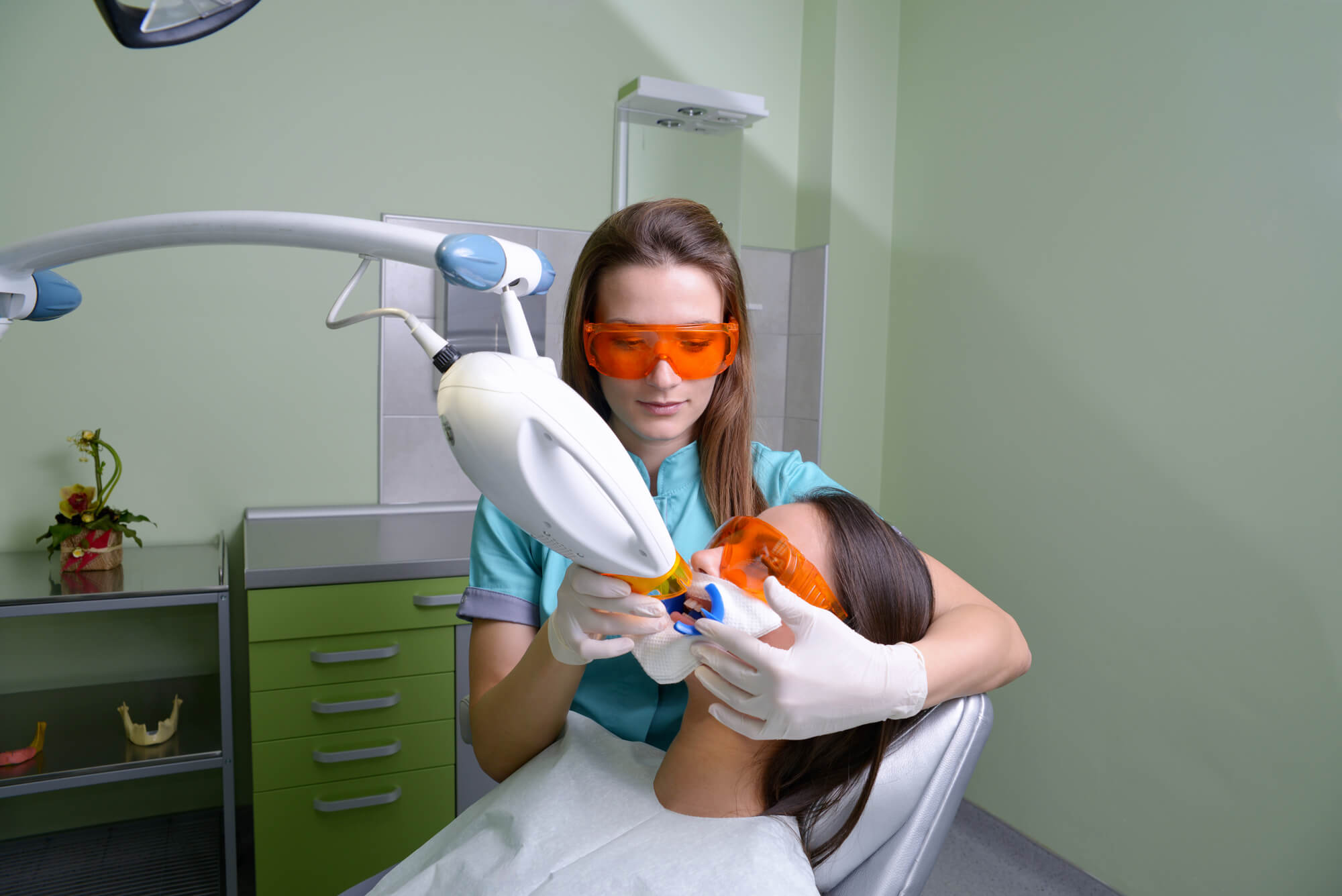 Dentist performing teeth whitening in Miami on a patient
