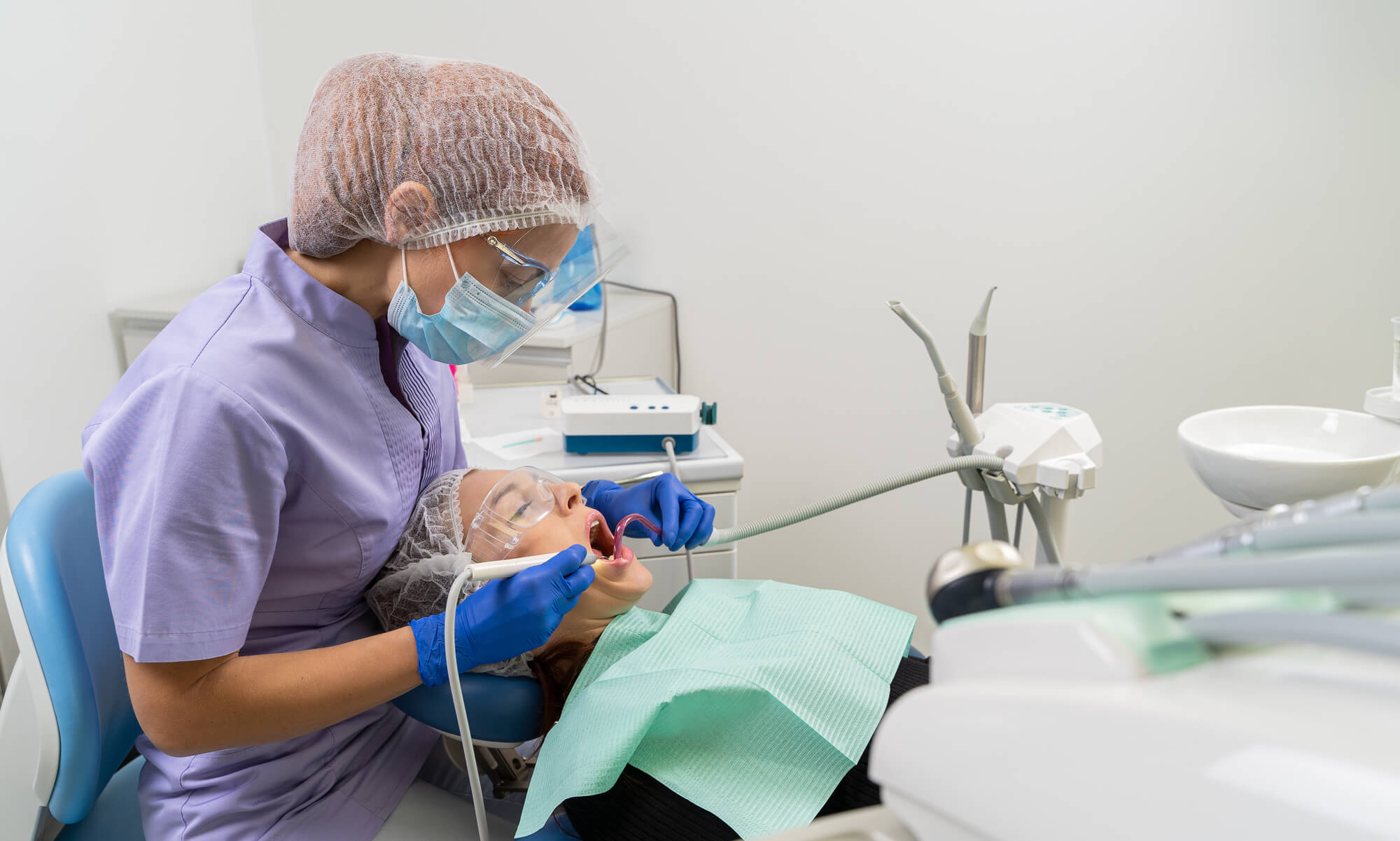 dentist during appointment for periodontics in Miami examining patient
