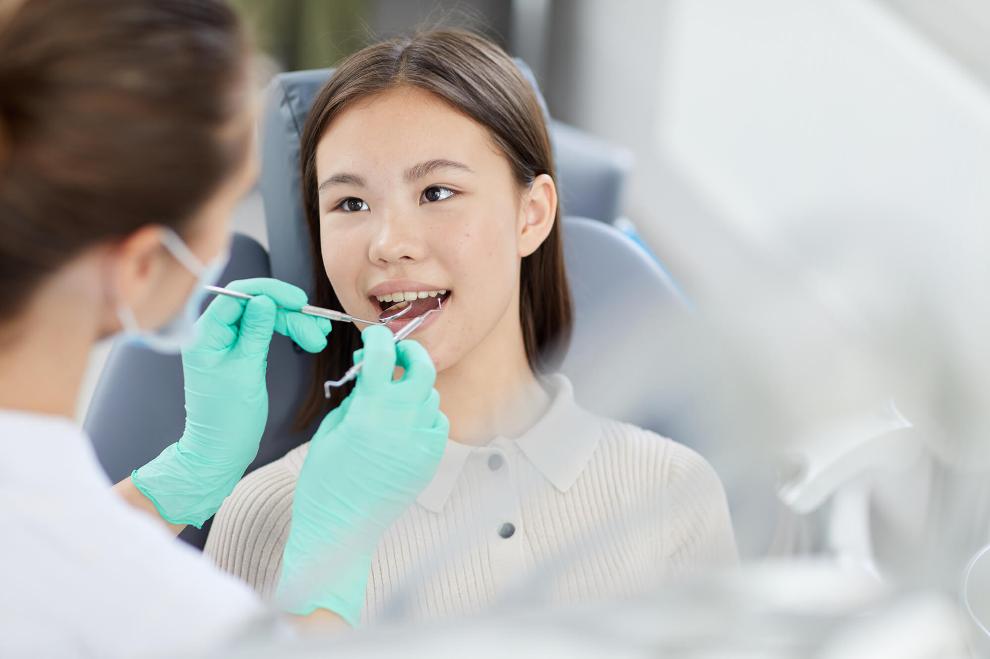 a dentist in pembroke pines examining patient