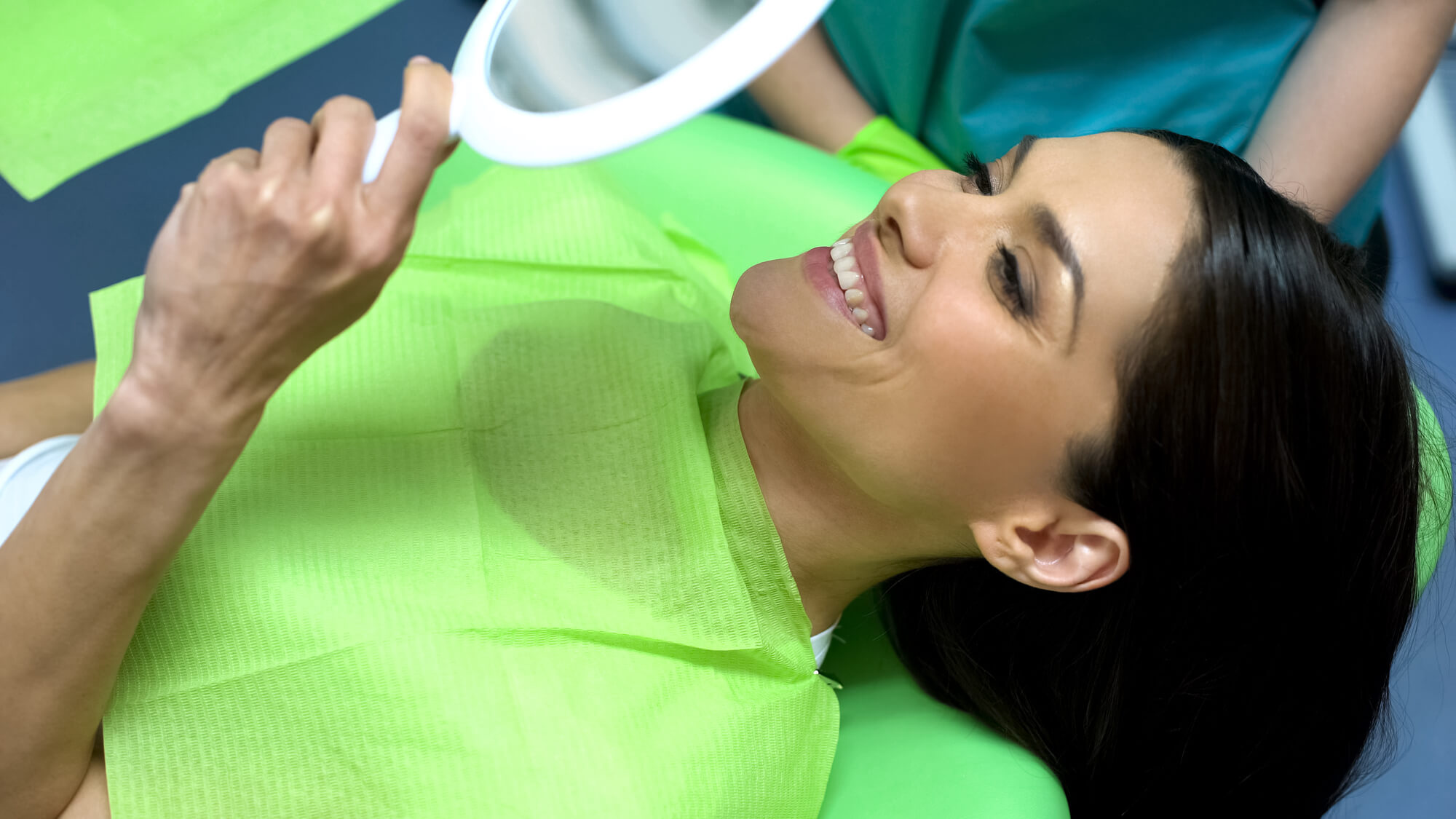 woman at the dentist after miami cosmetic dentistry